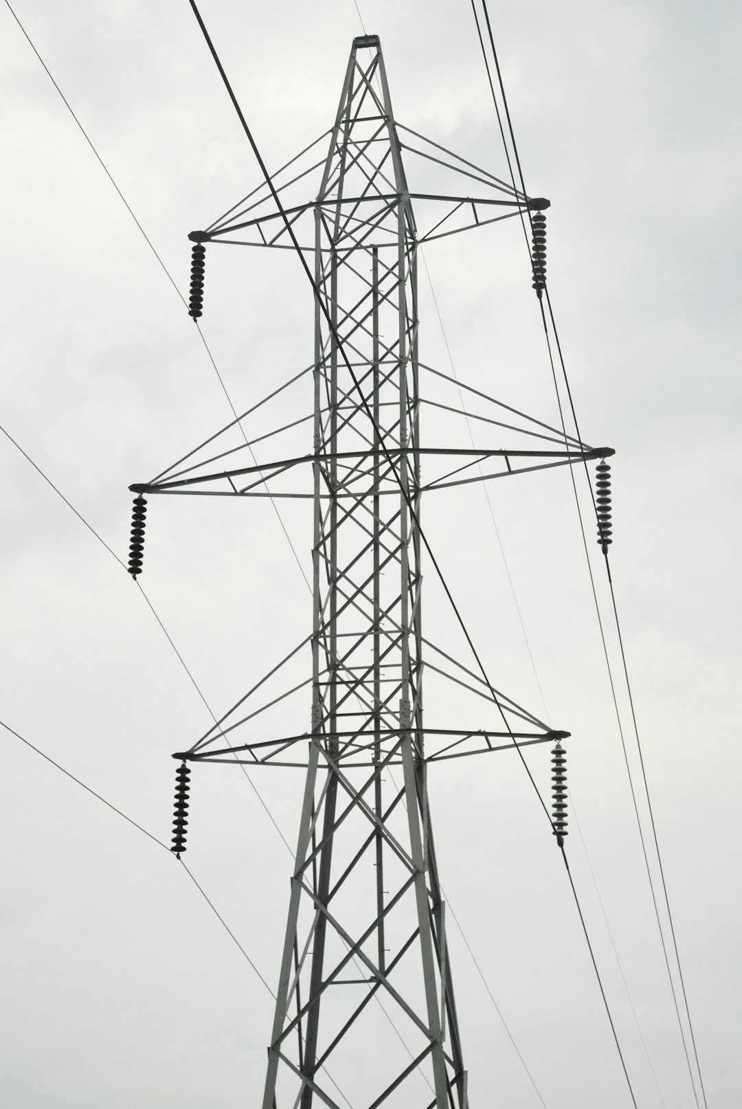 gray electric towers under gray sky