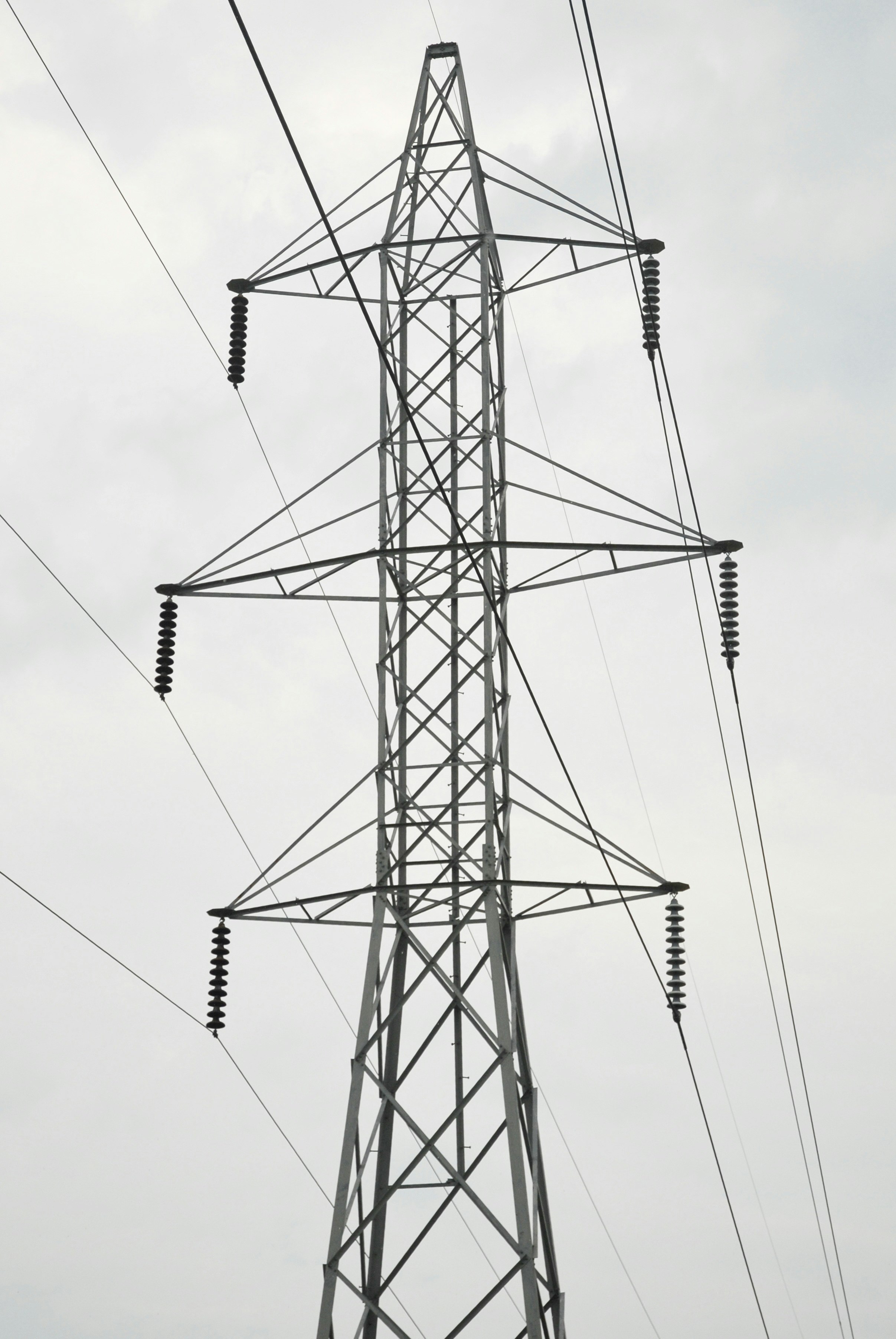 gray electric towers under gray sky