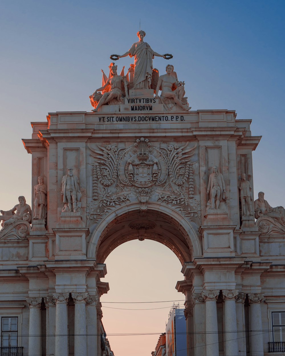 man riding horse statue under blue sky during daytime