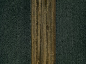 brown textile on black textile