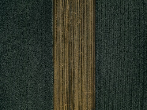 brown textile on black textile