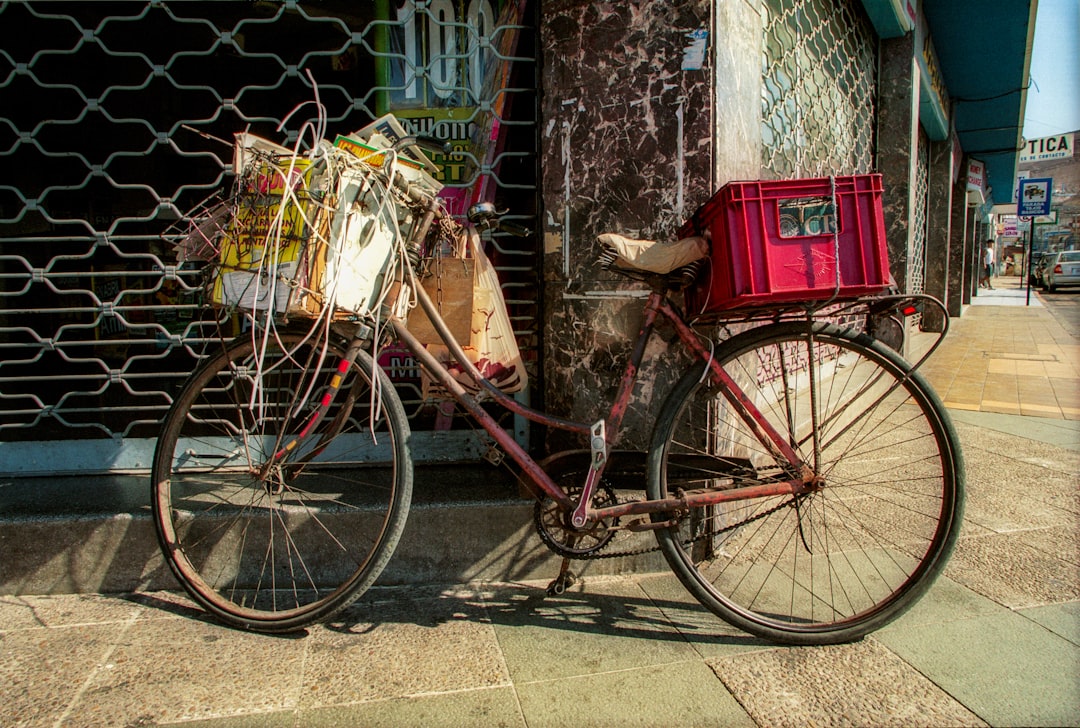 blue city bike with red box