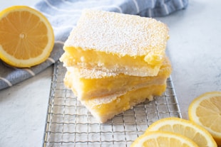 yellow cake on white and black checkered textile