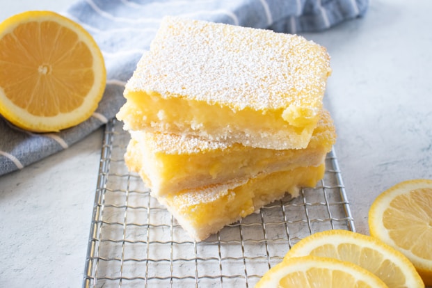 yellow cake on white and black checkered textile