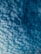 A cloud-filled sky with a textured pattern of fluffy, white clouds against a deep blue background. The clouds appear to be evenly distributed, creating an intricate and captivating visual effect.