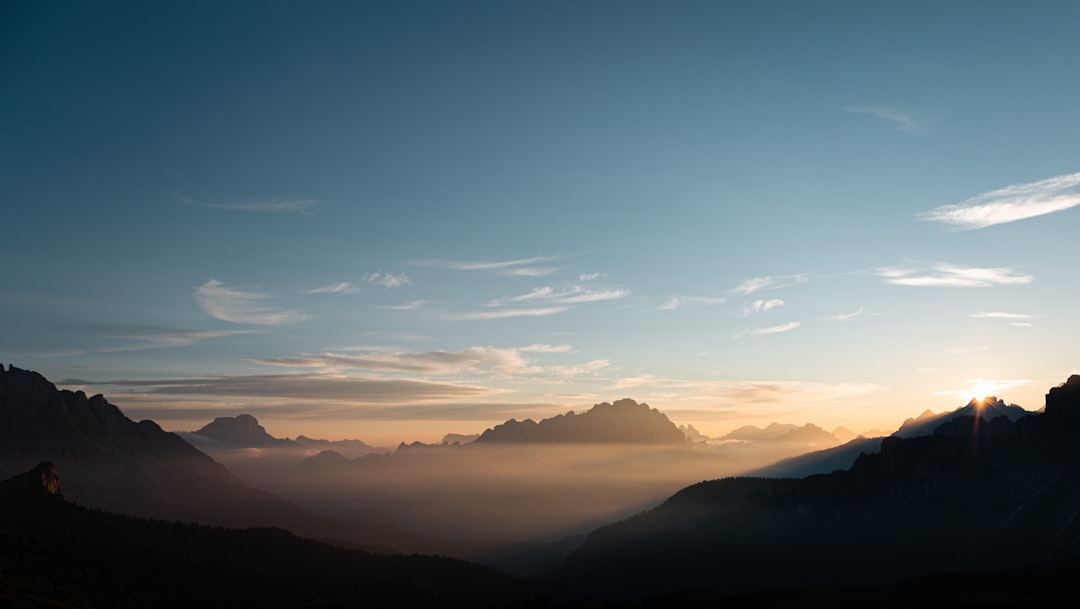 silhouette of mountains under blue sky during daytime