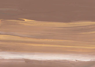 brown sand with blue water