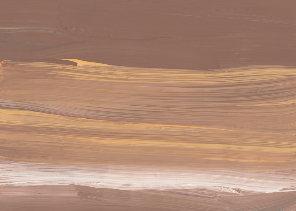 brown sand with blue water