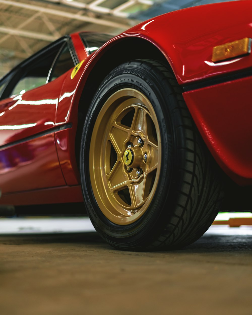 red car on gray asphalt road