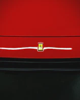Close-up of a shiny car emblem on a freshly imported vehicle.