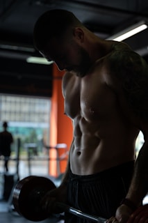 topless man in black shorts