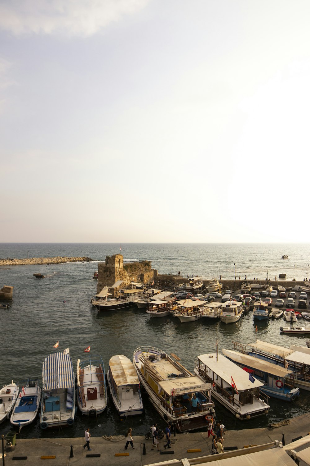 white and brown boats on sea during daytime