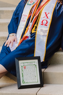 person holding black and white book