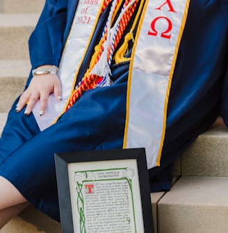 person holding black and white book