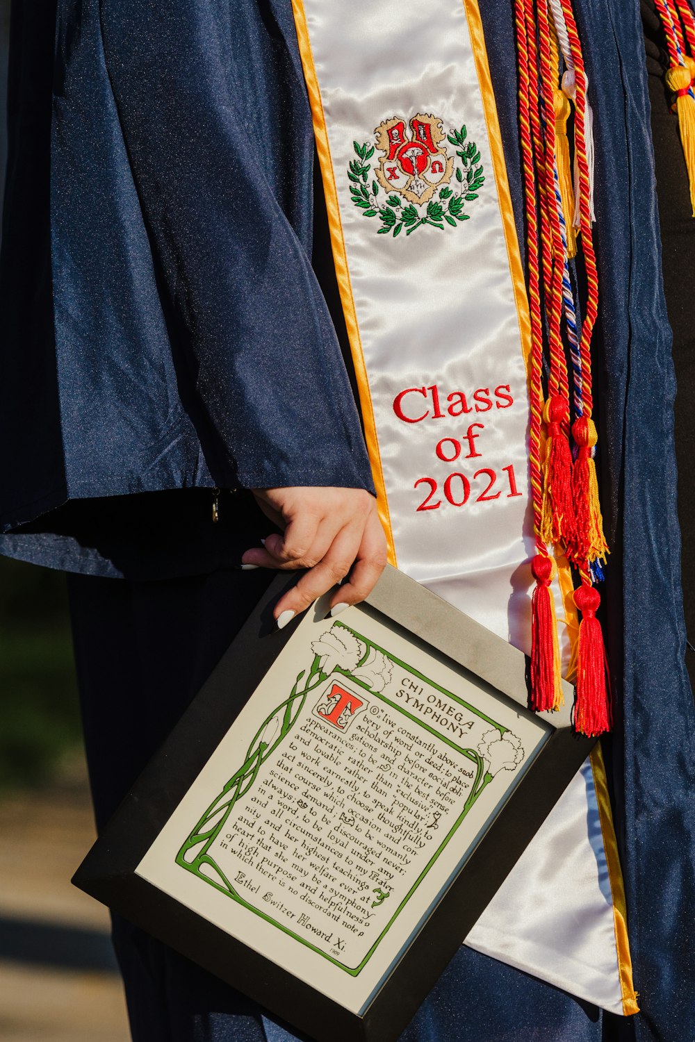 person holding white and green book