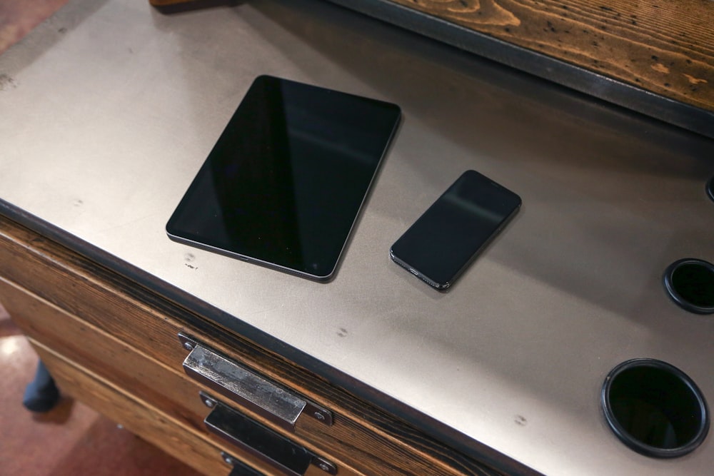 black android smartphone on white table