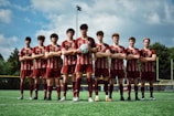 A vibrant photo of a soccer team wearing matching custom-designed jerseys and shorts on the field.