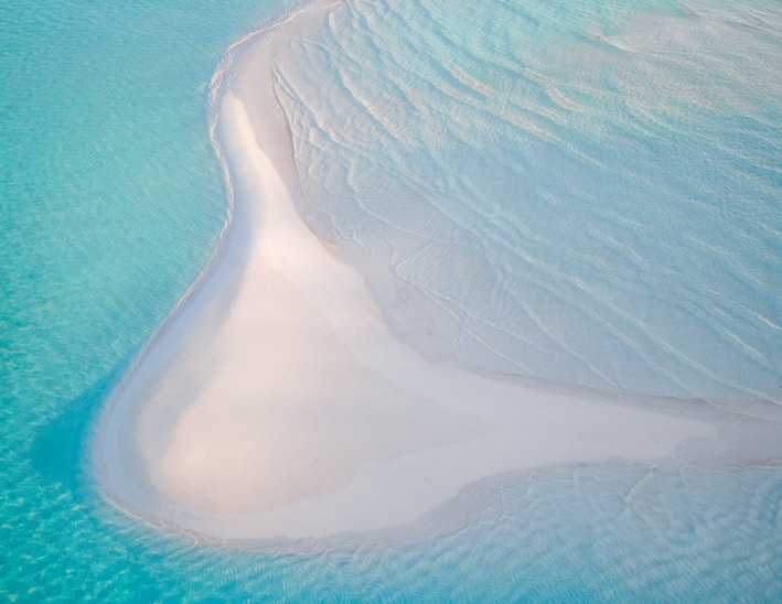 white and blue ocean water