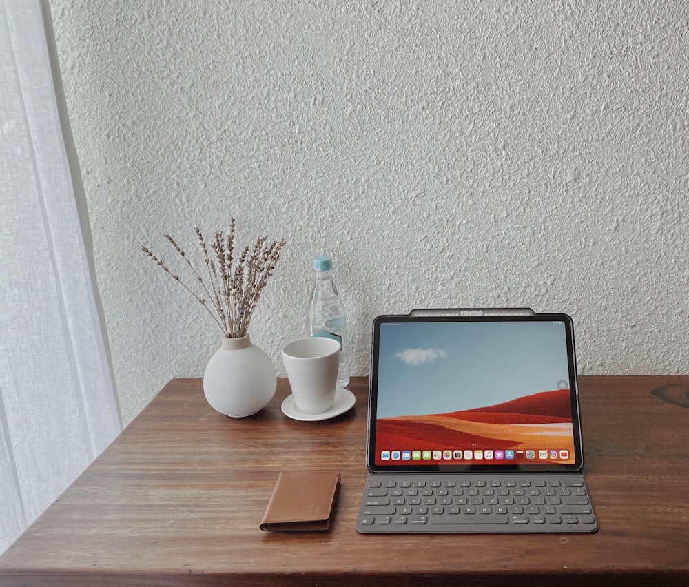 macbook pro on brown wooden table