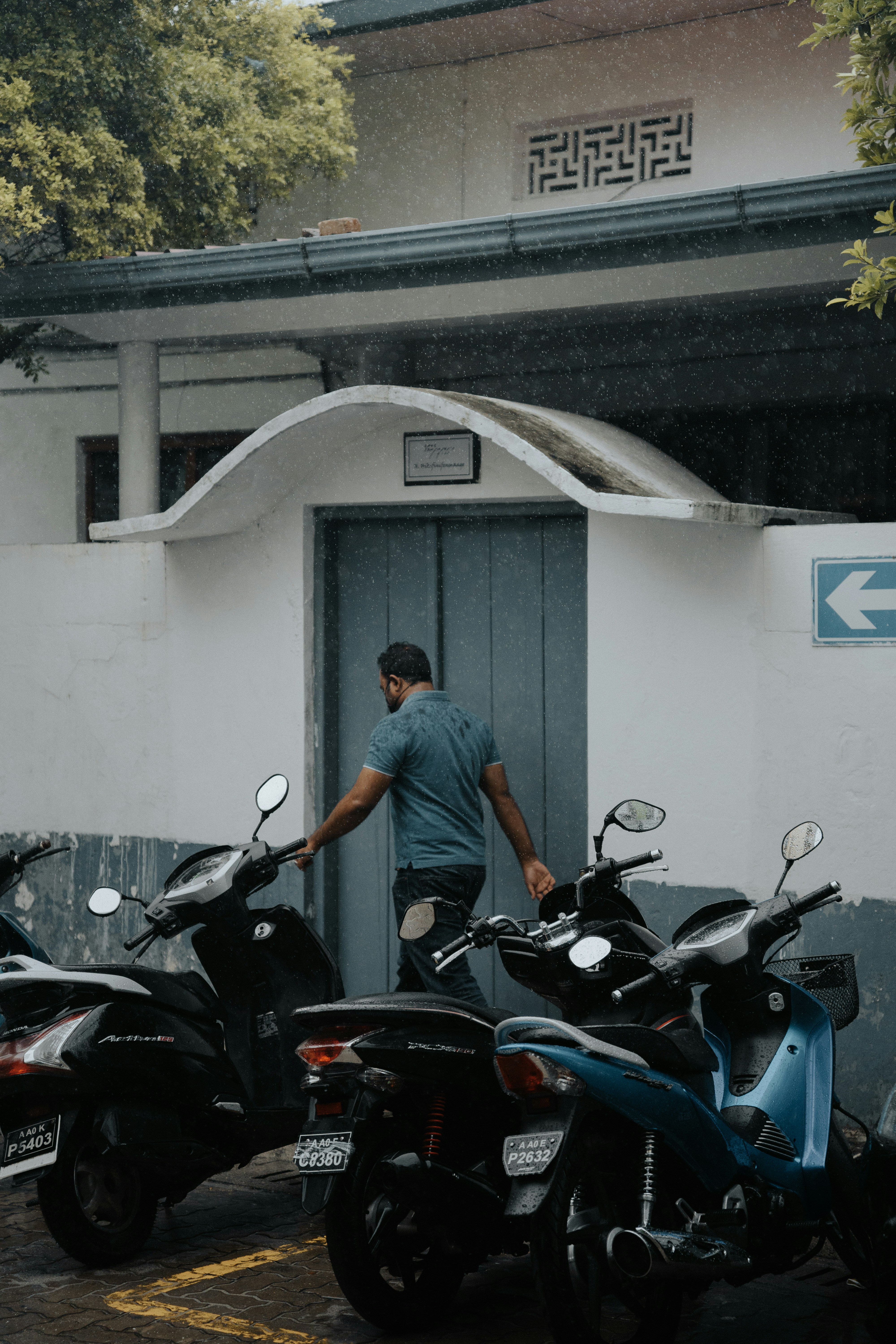 man in gray t-shirt riding on black motorcycle