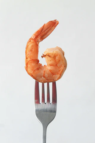 orange clay on stainless steel fork