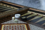 white and black ceramic mug on brown and white rug