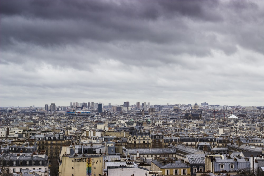 city buildings under gray cloudy sky during daytime