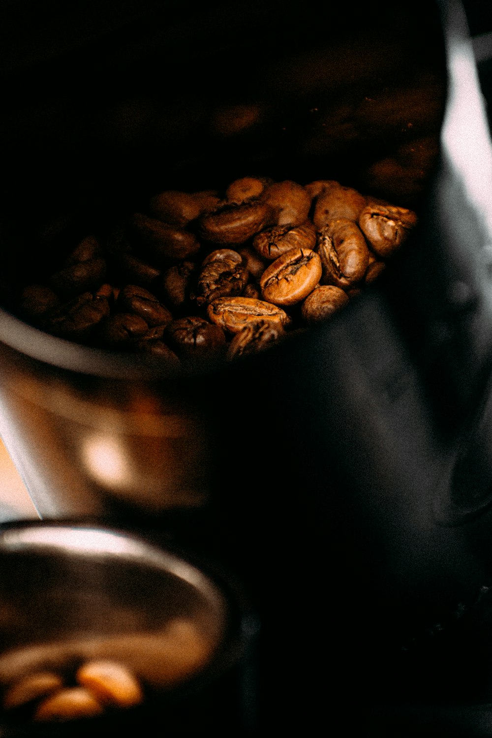 coffee beans in stainless steel cup