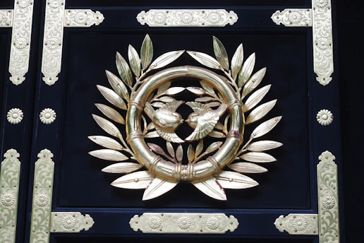 Sophisticated icon showing a rising arrow entwined with a gemstone and star motifs in royal navy and gold.