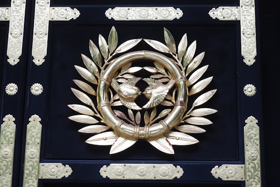 Elegant black and gold family crest emblem representing the Luos family legacy.