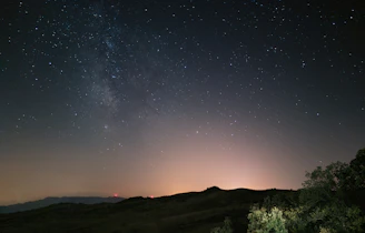 A serene rural night sky with shining stars and minimal light pollution.