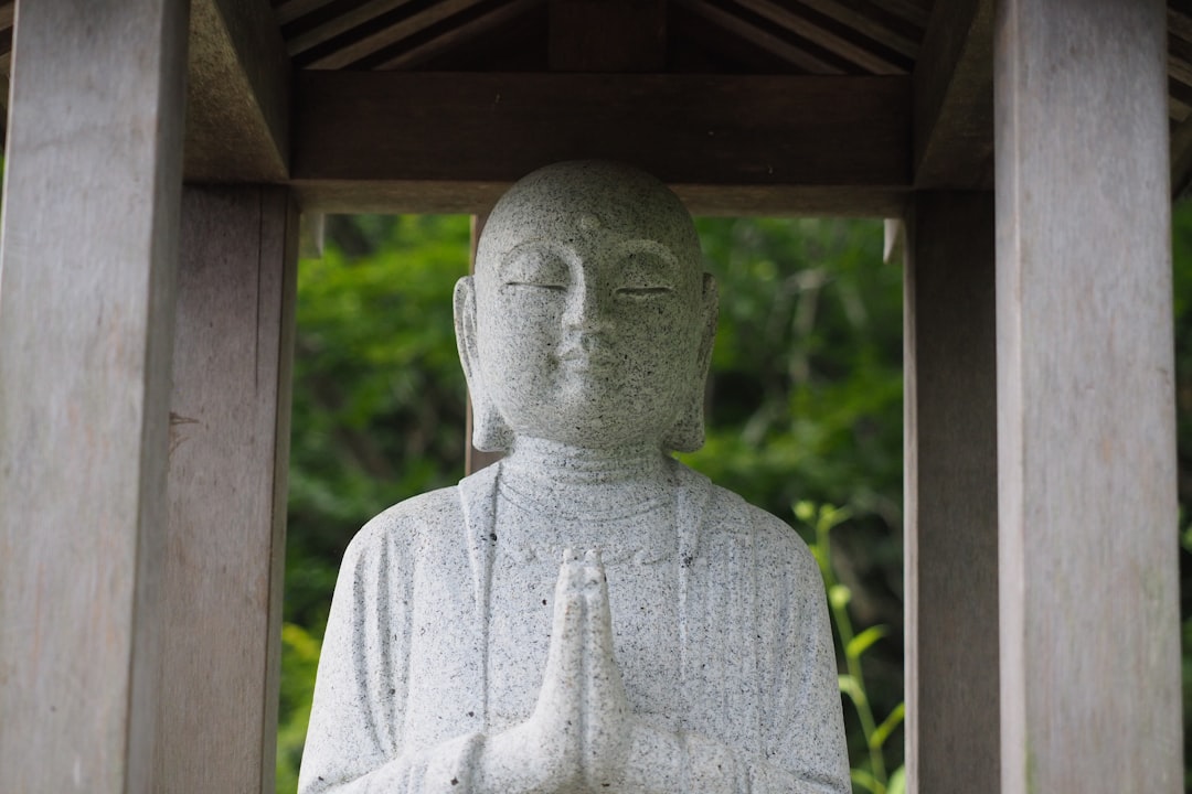 gray concrete statue during daytime