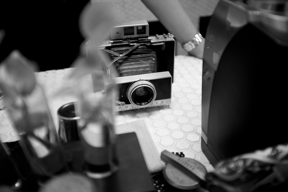 black and silver camera on table