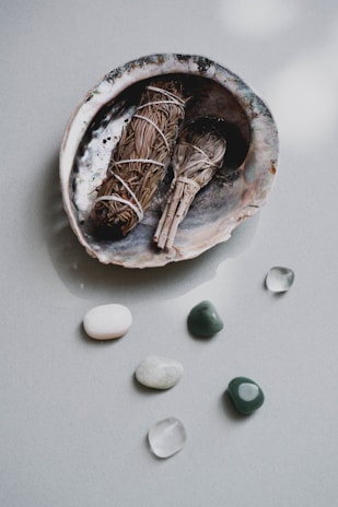 brown wooden round bowl with white round medication pill