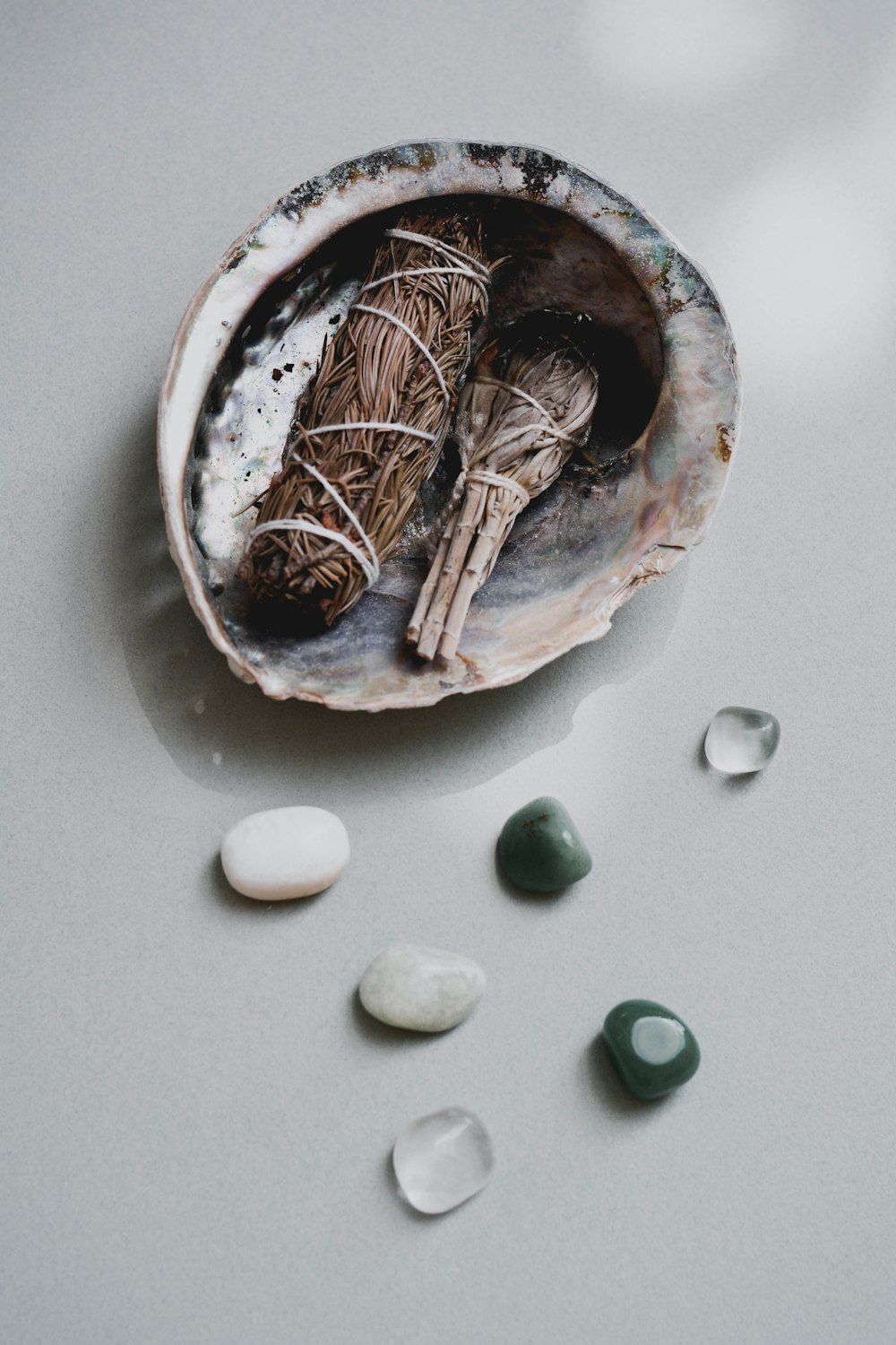 brown wooden round bowl with white round medication pill