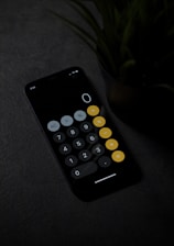 Calculator app on mobile calculating a tax free salary comparison between Canada and Saudi Arabia.