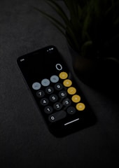 black remote control on gray textile