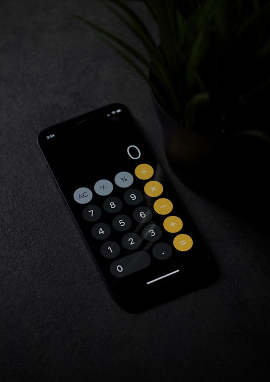 black remote control on gray textile