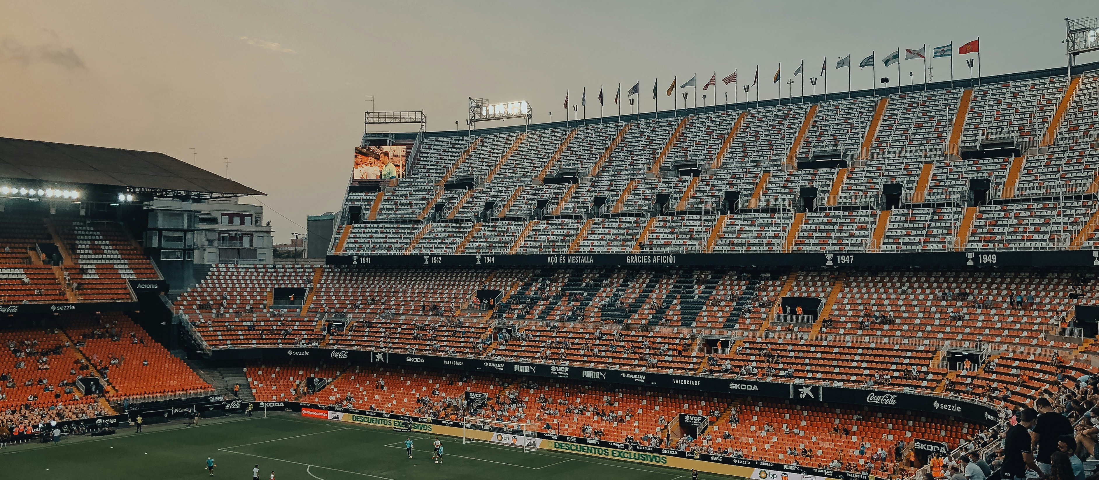 people watching football game during daytime