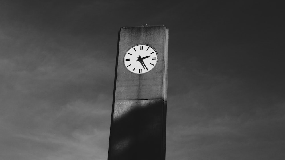 grayscale photo of analog clock