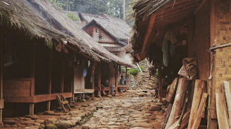 Travelers experiencing traditional Sasak village life in Lombok with local guides.
