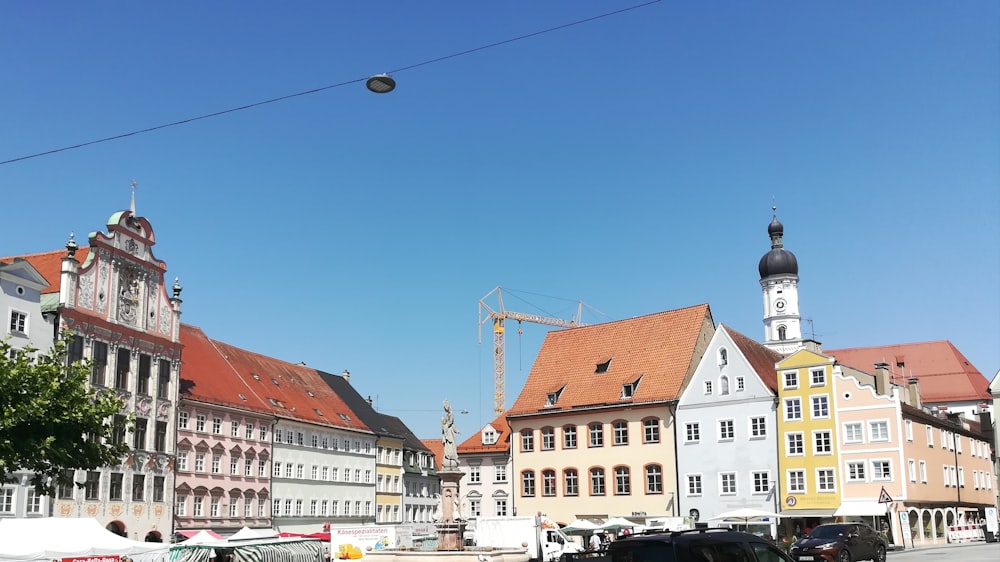 cars parked on street near buildings during daytime