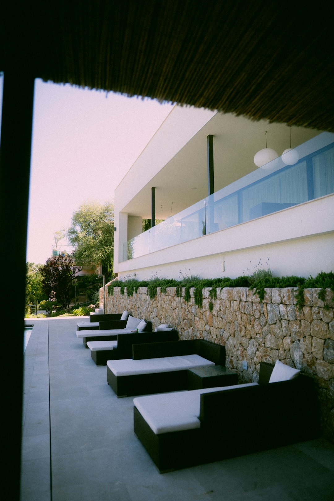 white concrete building near green trees during daytime