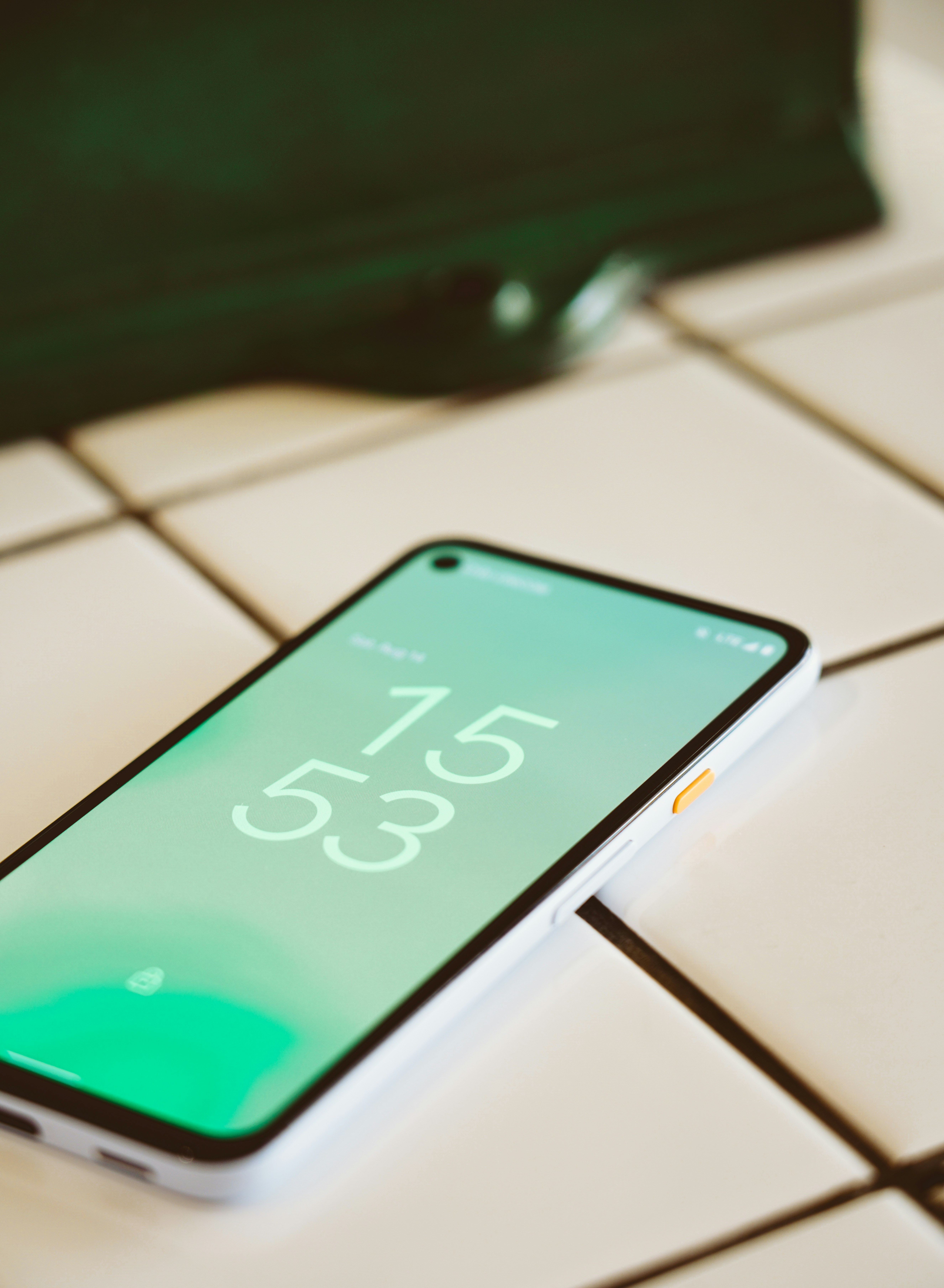 black android smartphone on white and black computer keyboard