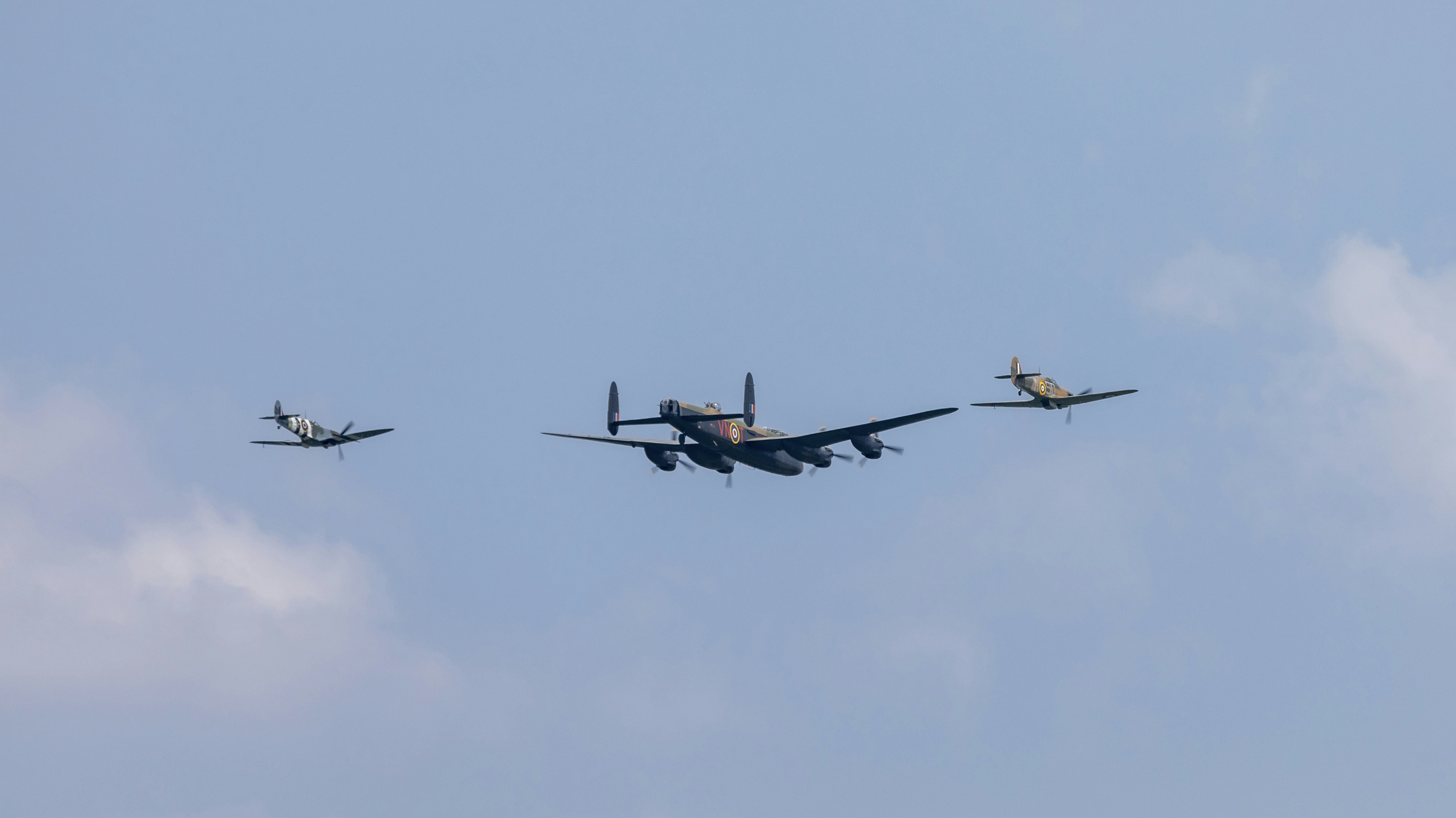 black and red jet plane in mid air during daytime, 