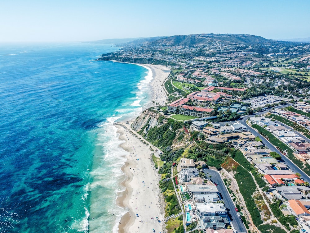 aerial view of city near body of water during daytime