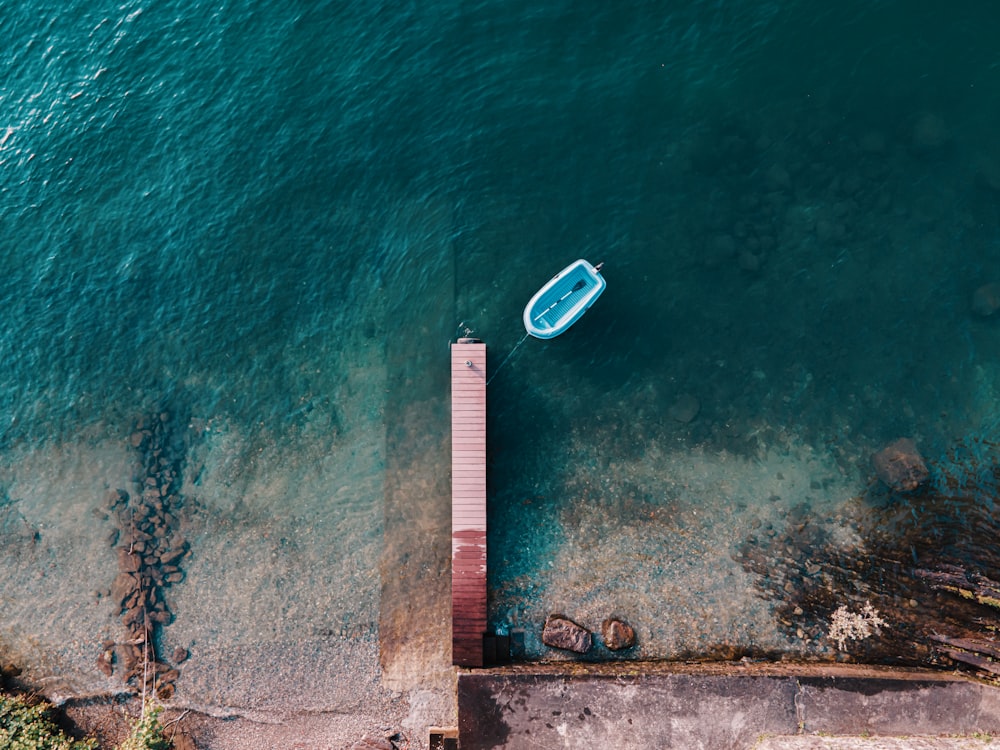 aerial view of white boat on sea during daytime