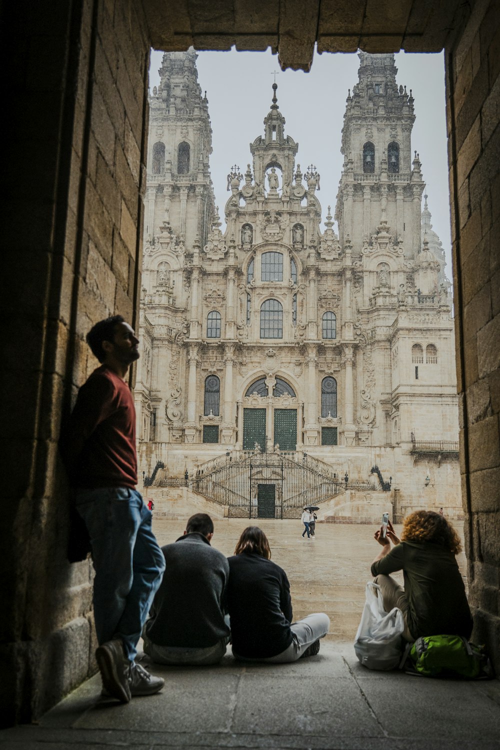 Pilgrims walking near the historic cathedral quarter of Santiago de Compostela, Spain