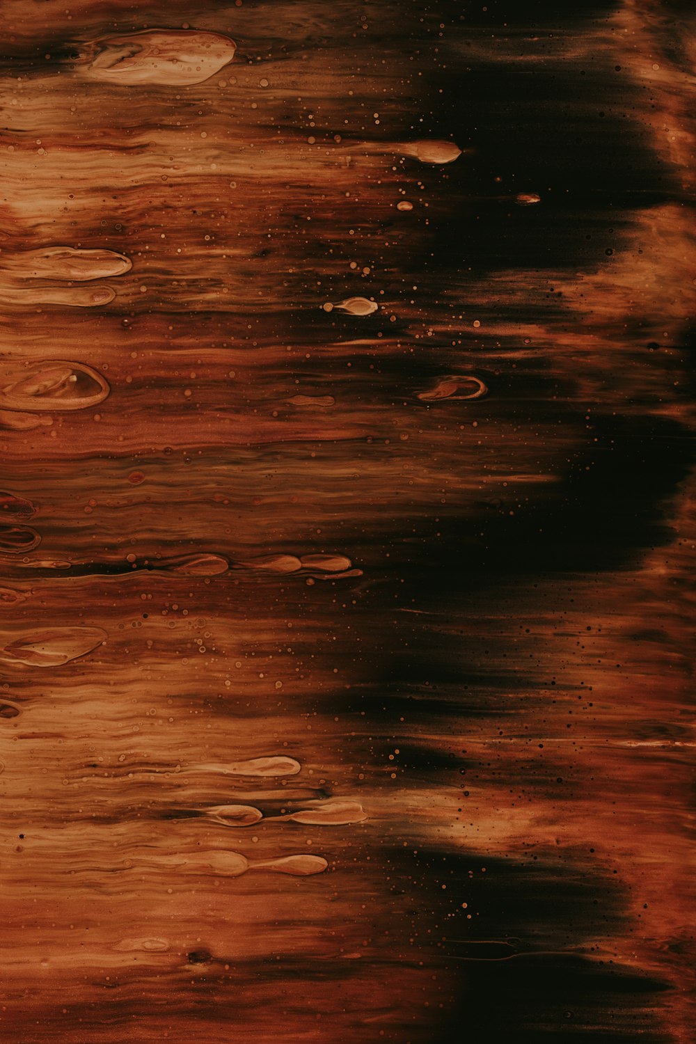 water droplets on brown surface