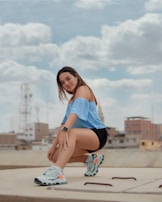 A model stretching effortlessly in a sleek, modern activewear set on a sunny city rooftop.